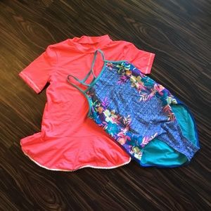 Blue tropical one-piece with hot pink ruffled edge rash guard